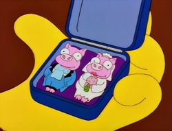 Pig cufflinks.png