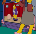 Mayor Quimby is seen on TV with his pants down, next to Plopper, a reference to the episode "The National Anthem".png